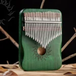 21-key green solid maple Kalimba - Sun motif