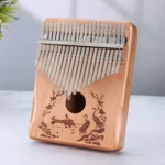 Kalimba 21 lames bois de hêtre massif - couleur bois clair vernis - Motif asiatique bateau et grues